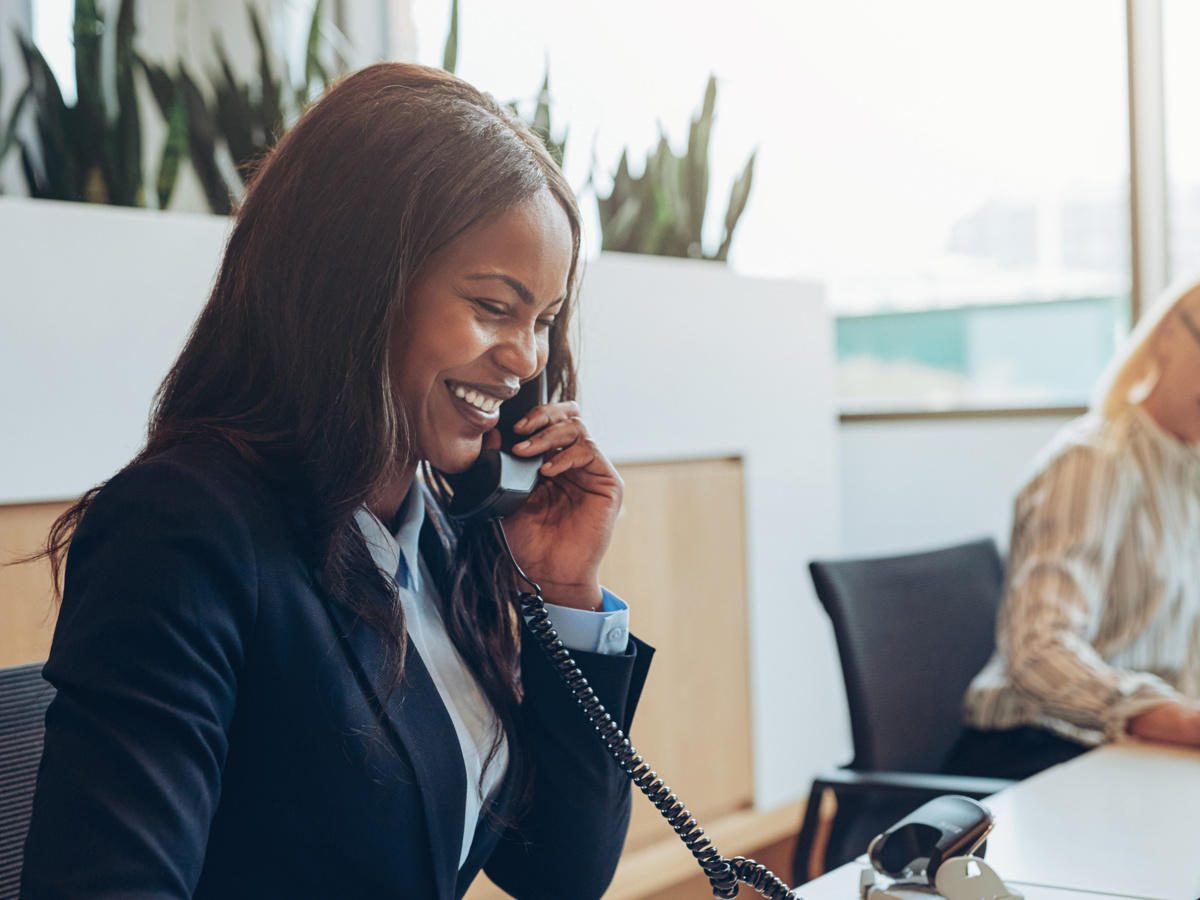 A membership officer on the phone to a member