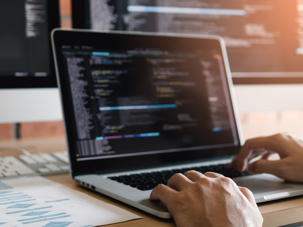 Hands mid-keystroke, working a problem through