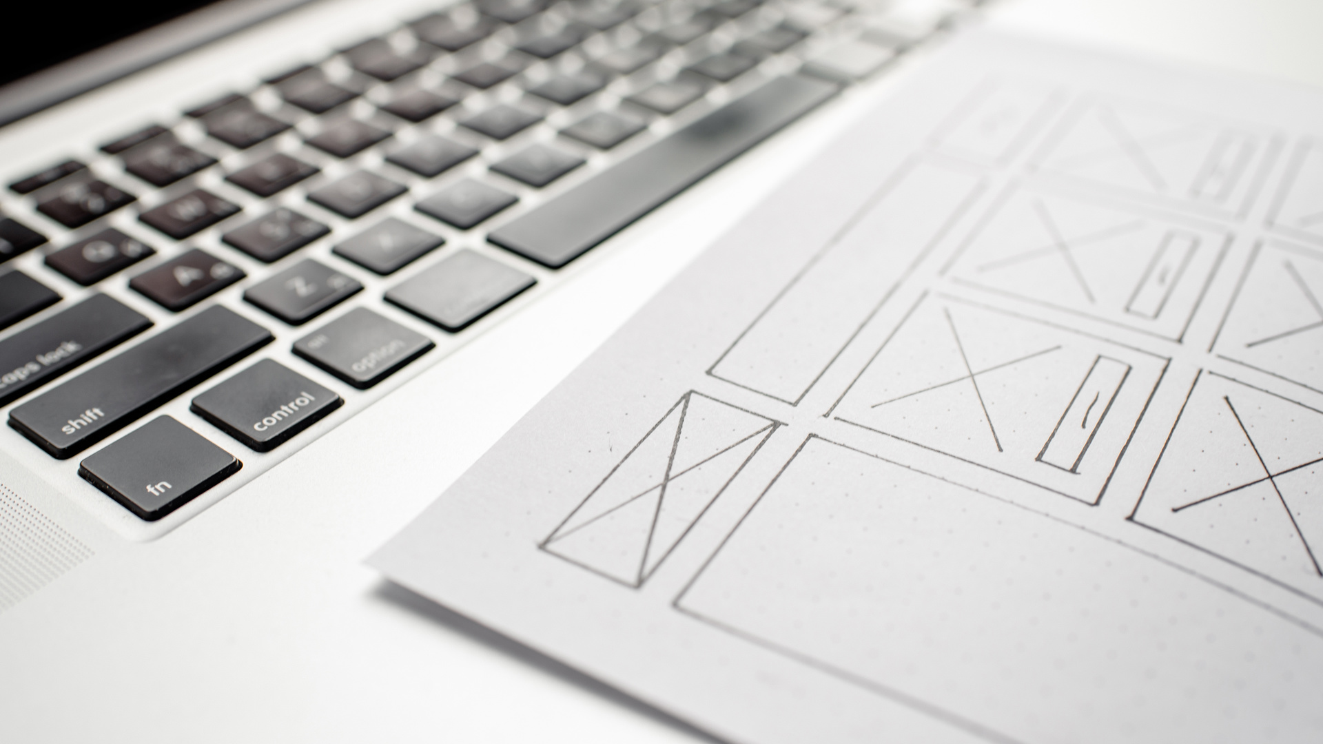 A designer sketching the layout of a web page before building it