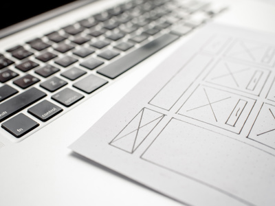 A designer sketching the layout of a web page before building it